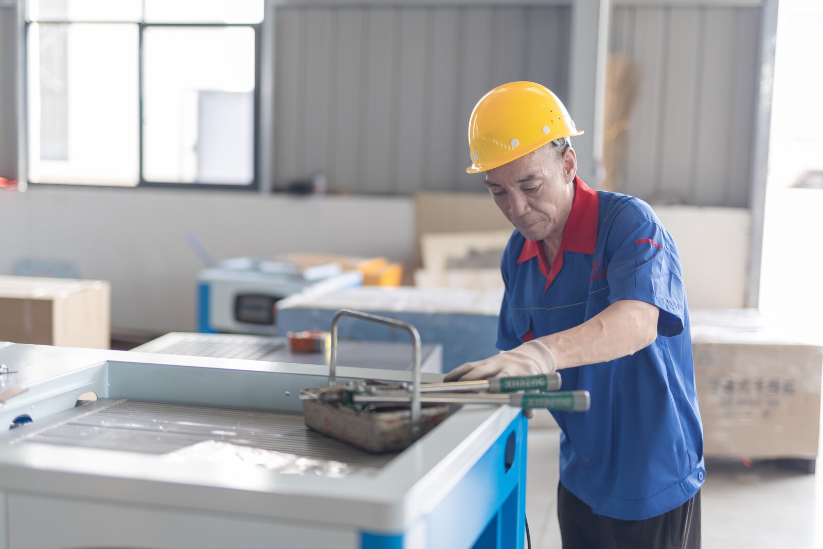 Dazhang technician preparing components on the production floor
